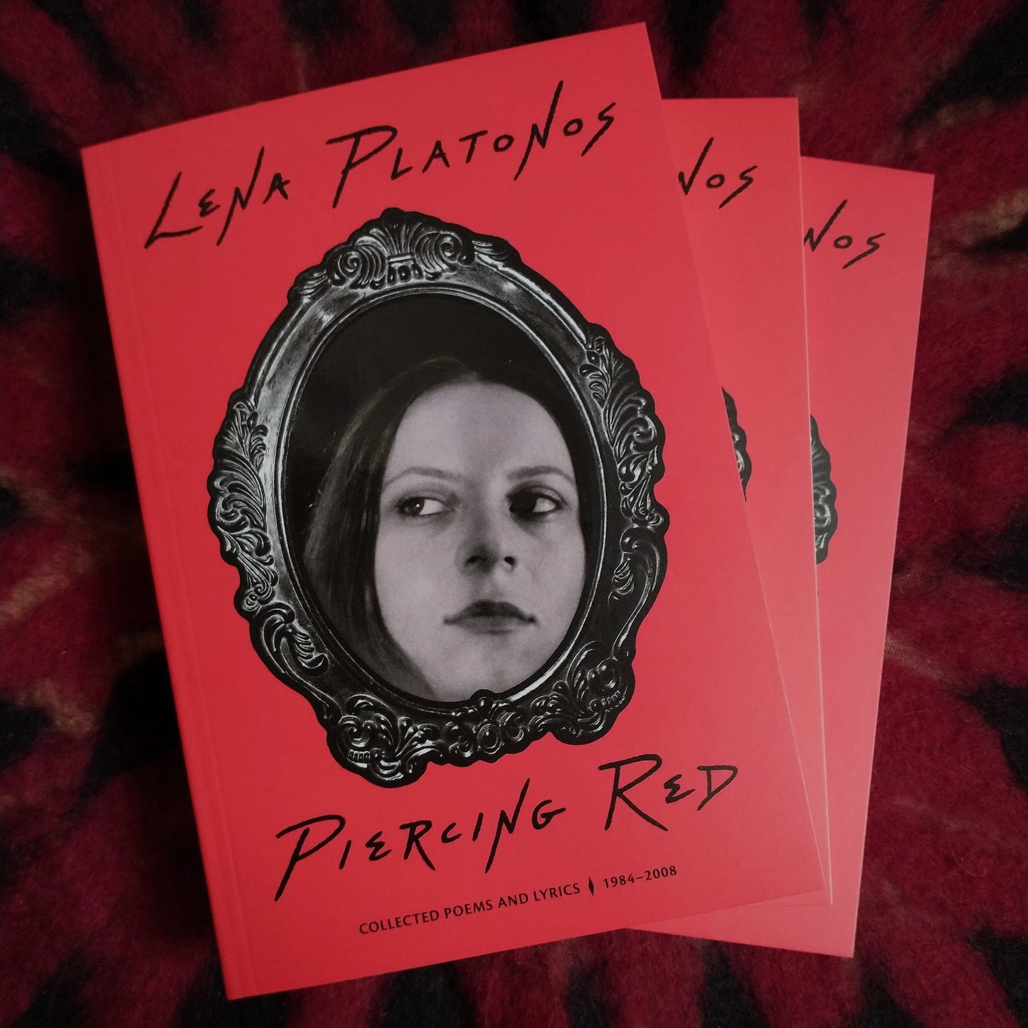 Lena Platonos - Piercing Red Softcover Book